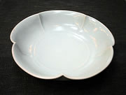 white porcelain bowl with flower rim