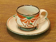 coffee cup with red arabesque pattern