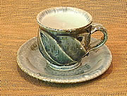 blue glazed coffee cup with facets trimming